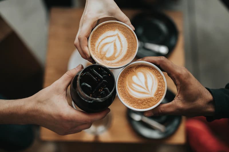 Barista preparing coffee in a warm, inviting cafe atmosphere